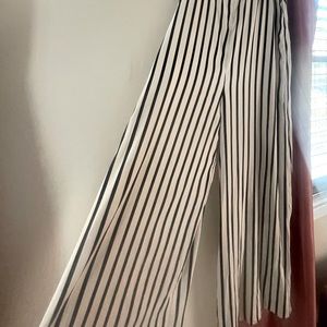 Black and cream women’s BCBG romper/jumpsuit comfortable free fit.